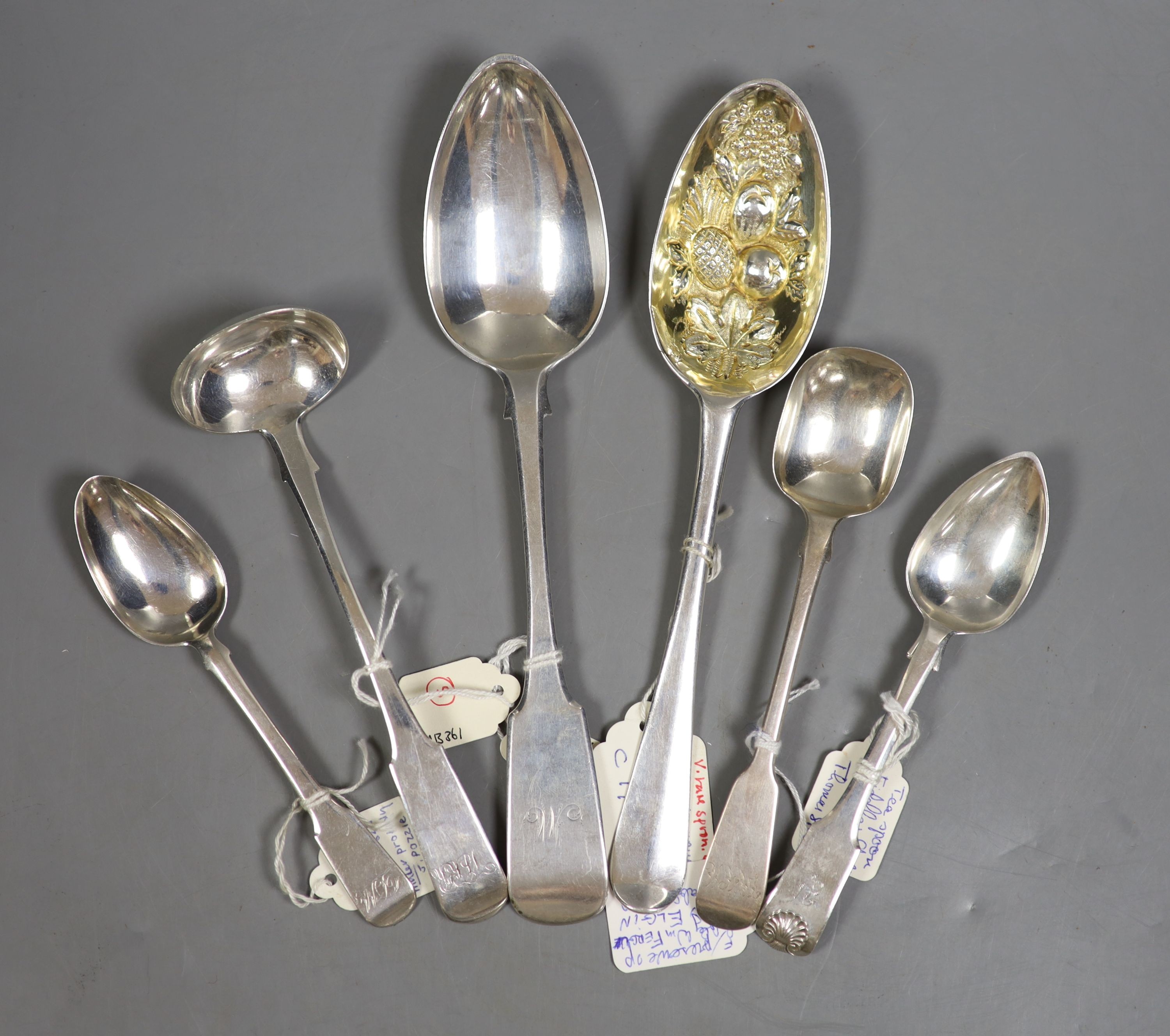 A mid 18th century Scottish provincial silver Hanovarian pattern 'berry' spoon, James Humphrey, Elgin, c.1753, 21.5cm and five other 19th century items of Elgin silver flatware, tablespoon and preserve spoon by William F